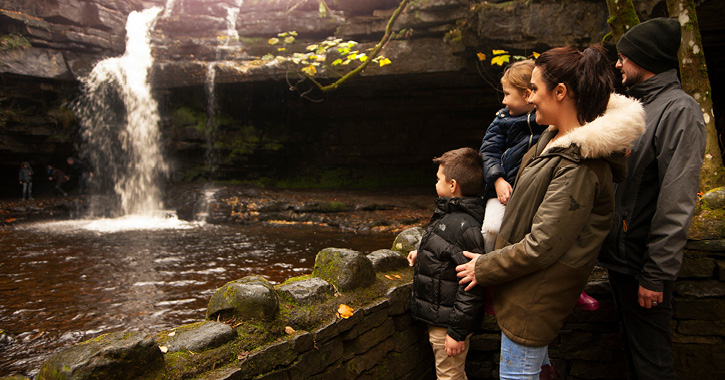 Family admiring Gibson's Cave in the Durham Dales